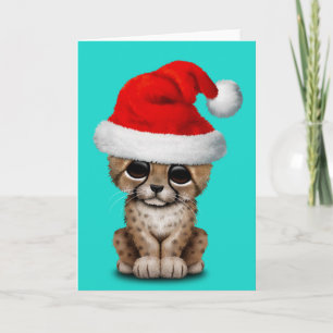 Gullig Cheetahunge som ha på sig en Santa hatt Helgkort