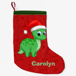 Gullig grön babyDinosaur med den Santa hatten Liten Julstrumpa