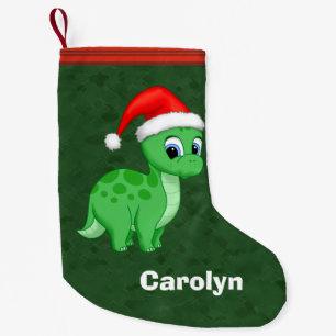 Gullig grön babyDinosaur med den Santa hatten Liten Julstrumpa