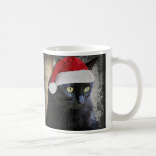 Gullig julkatt i den Santa hatten, kaffemugg