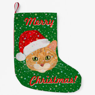 Gullig katt i jultomtenhatt med snöflingor liten julstrumpa