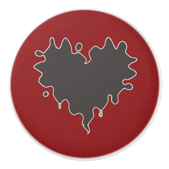 Gullig lockig hjärtasvart på röd keramisk knopp (Framsidan)