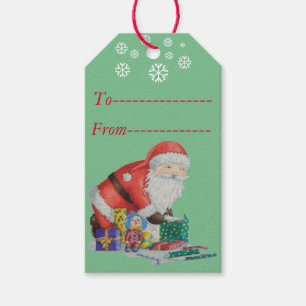 Gulliga santa och leksaker som slår in julgåvor presentetikett