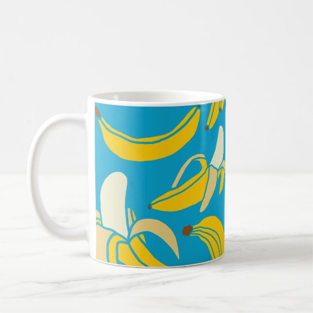 Gult bananer, blå bakgrund mönster kaffemugg (Vänster)