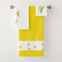 Gult blomma med grönt löv på vitt