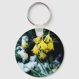 Gult Daffodils blommor i snö Nyckelring