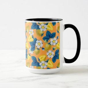 Gult jordgubbar på orange mugg