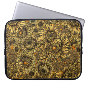 Gult krysantemum blommor och skalbaggar av orange laptop fodral