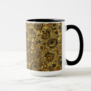 Gult krysantemum blommor och skalbaggar av orange mugg