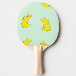 Gult lycklig bunnier på teal pingisracket