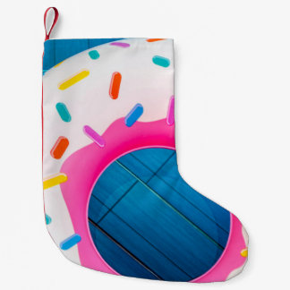 Gult- och rosa-ringnötsfloater liten julstrumpa