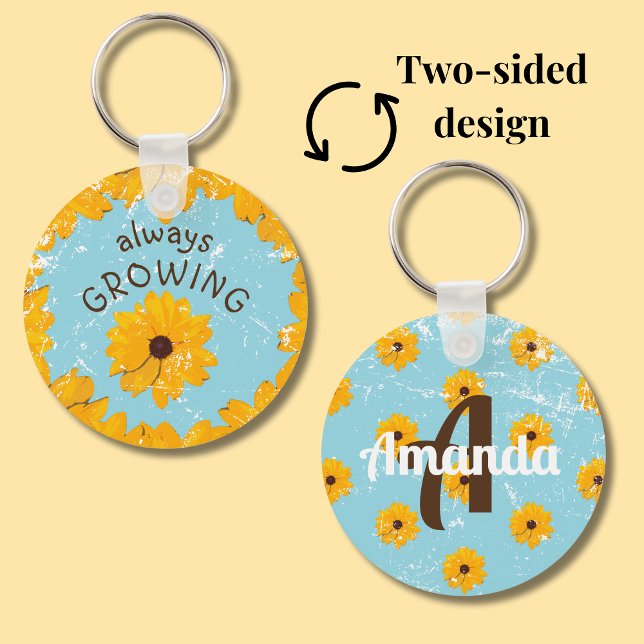 Gult Rustic Robin Egg Blue växer alltid färdigt Nyckelring (Sky blue round metal keychain with yellow flowers features a spot for a first name and initial.)
