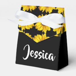 Gult solblommor på svart presentaskar