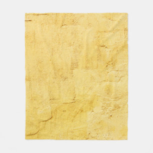 gultens abstrakt texturerat plåster på väggen fleecefilt
