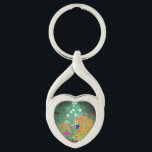 Gustav Klimt Blomsterträdgård Twisted Heart Silverfärgad Nyckelring<br><div class="desc">Nyckelkedja med Gustav Klimts Blomsterträdgård för oljemålning (1906). En vacker trädgård av lila,  rött,  vitt,  blått och orange blommor. En underbar gåva till fläkt av Art nouveau och österrikisk konst.</div>