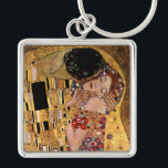Gustav Klimt: Kyssen (specificera), Fyrkantig Silverfärgad Nyckelring<br><div class="desc">En härlig klassikernyckelring som presenterar en romantiker,  kopplar ihop att dela en kyss som målas av den österrikiska symbolistmålare Gustav Klimt.</div>