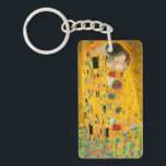 Gustav Klimt the Kiss<br><div class="desc">Nyckelkedja med Gustav Klimts oljemålning med guld löv Kiss (1908). En man och kvinna,  som bär briljant gyllene färg,  tar gärna till sig och kysser i ett fält av blommor. En underbar gåva till fläkt av Art nouveau och österrikisk konst.</div>