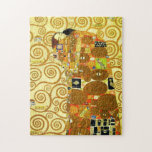 Gustav Klimt uppfyllelsepussel Pussel<br><div class="desc">Gustav Klimt uppfyllelsepussel. Fris från 1909. Avslutat under guld- Klimts arrangera gradvis, kopplar ihop uppfyllelsesärdrag omfamna innehav varje annat under ettmönstrat täcke som presenterar spiraler, ögon, fåglar, fisk, och annat formar. Bakgrunden av arbetet presenterar samma brons spiraler som skulle smyckar konstnärens berömda livets träd. En underbar gåva för fläktar av...</div>