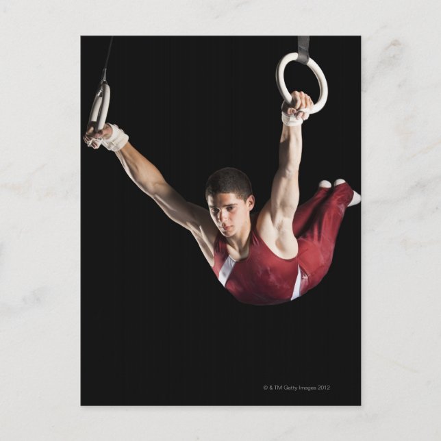 Gymnast swinging från ringar vykort (Framsida)