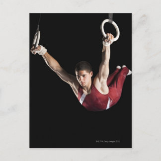 Gymnast swinging från ringar vykort