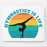 Gymnastik är Life Bevackra Sunset Gymnast Teal Musmatta<br><div class="desc">Gymnastiken är Life. Gastgåva i solnedgång med en vacker färgstark bakgrund bakom en kvinna som gör ett söt handställ med spalterna.</div>