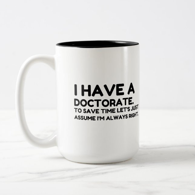 HA EN DOKTORAT I SPARTIDEN Två-Tonad MUGG (Vänster)
