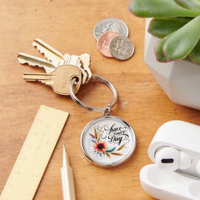 Ha en trevlig blommigt rund silverfärgad nyckelring (Skrivbord)