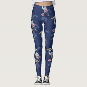 Häger i den rosa lotusträdgården på delphinblått leggings