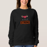 Håll dig stark t shirt<br><div class="desc">Bär motståndskraft med varje bära. Konstruktionen "Håll dig stark" är en påminnelse om att styrkan kommer inifrån, oavsett utmaningar.</div>