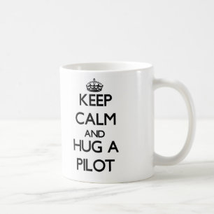 Håll lugn och krama ett pilot- kaffemugg
