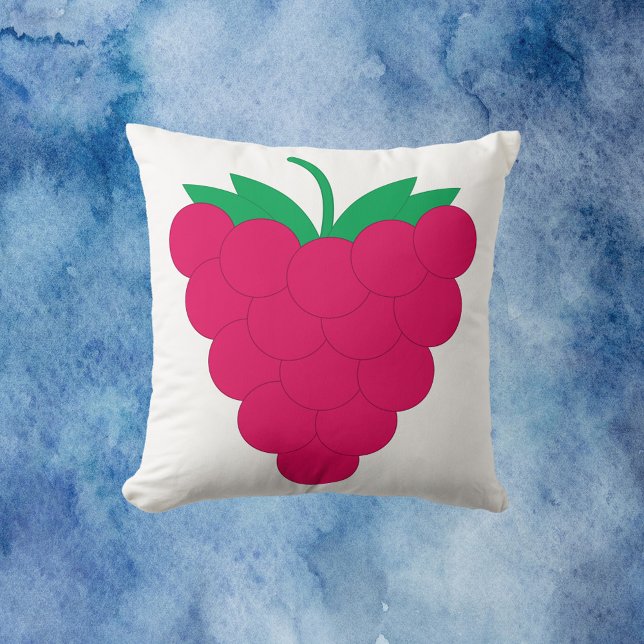 Hallonsortens rosa frukt  kudde (A throw pillow with a graphic of a pink raspberry with a green stem.)