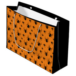 Halloween-mönster med spindlar i svart och orange