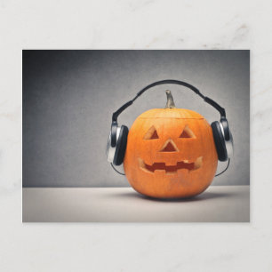 Halloween-pumpa med hörlurar för musik vykort