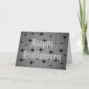 Halloween-spindlar på grått-avfettad damm kort