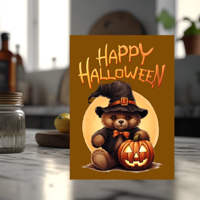 Halloween Teddybjörn Kort (Halloween card with teddy bear on the front sits on top of a kitchen counter.)
