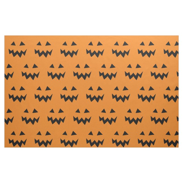 Halloween tyg med det sned pumpaansiktemönster (Fat Quarter)