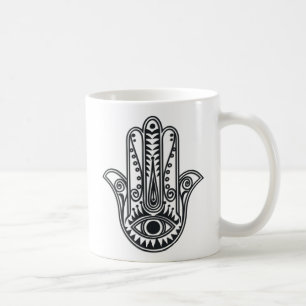 Hamsa räcker kaffemugg