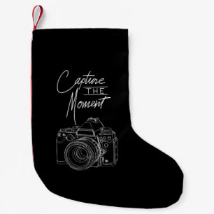 Hämta fotografi av modern kamera. liten julstrumpa