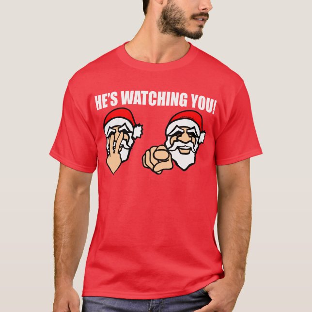 HAN HÅLLER ÖGONEN PÅ DIG! T-SHIRT (Framsida)