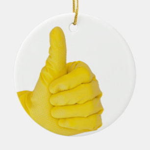 Hand i gult latexhandske julgransprydnad keramik