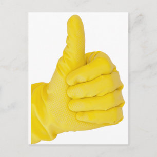 Hand i gult latexhandske vykort