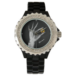 Hand med en strålningssymbol armbandsur