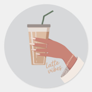 Hand som håller en kopp kaffe runt klistermärke