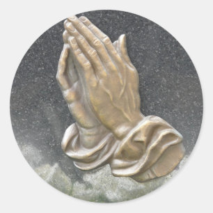 HÄNDER PRAYER RUNT KLISTERMÄRKE