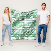 Handflatan löv på en strimlad svart och vit botten