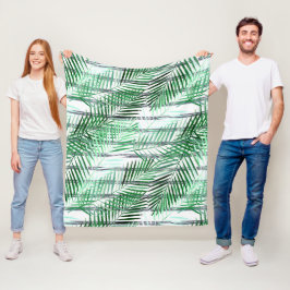 Handflatan löv på en strimlad svart och vit botten fleecefilt