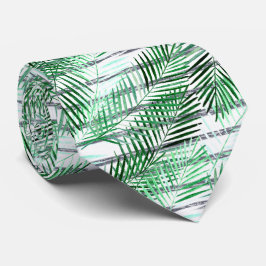 Handflatan löv på en strimlad svart och vit botten slips