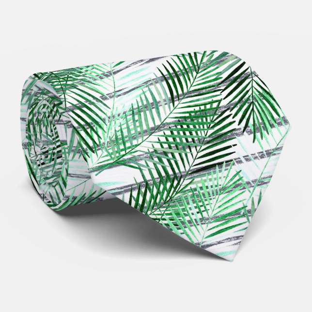 Handflatan löv på en strimlad svart och vit botten slips (Rullad)