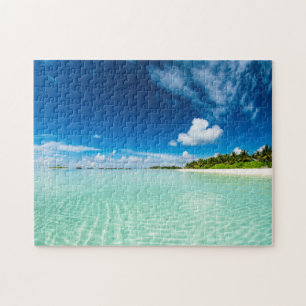 Handflatan strand vid djupt blå himmel aquamarine pussel