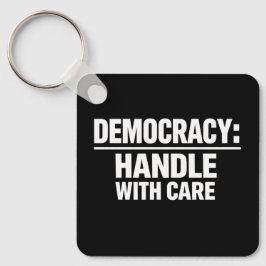 Handle Democracy With Care Nyckelring